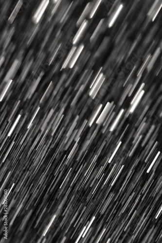 Abstract dynamic white lines on a black background in motion.