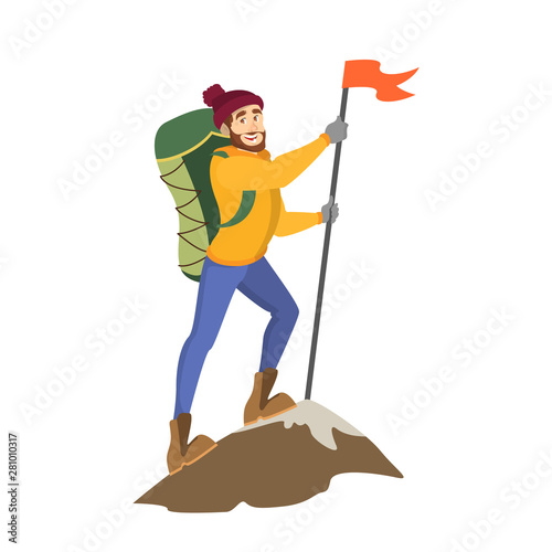 Male alpinist standing on top of the mountain
