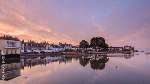 Soft dawn sky over riverside properties with a mirror calm River Exe at Topsham, Devon photo