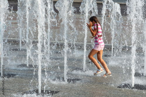 Fototapeta Naklejka Na Ścianę i Meble -  girl playing with water works