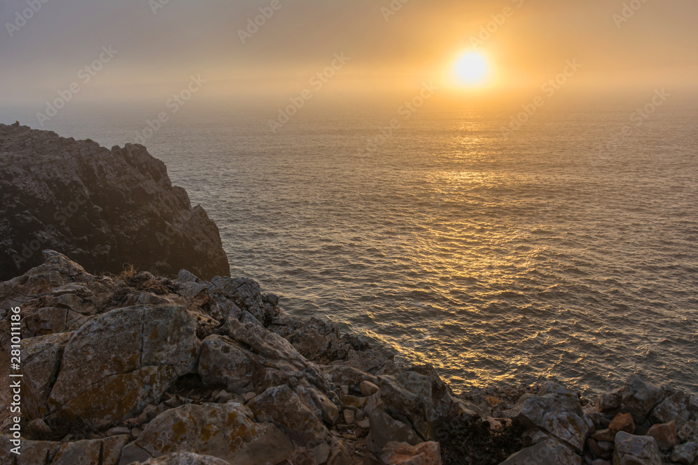 Sunset at the cape of San Vicente (in Portuguese Cabo de São Vicente) located in the southwestern tip of Portugal. It is located near Sagres (Portugal) Sunset at the cape of San Vicente (in Portuguese Cabo de São Vicente) located in the southwestern tip of Portugal. It is located near Sagres (Portugal)