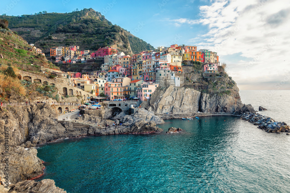 The best panorama of Italy. Manarolla. Ligurian coast. Cinque Terre National Park. Stone path to the sea. Medieval town on a rock by the sea.