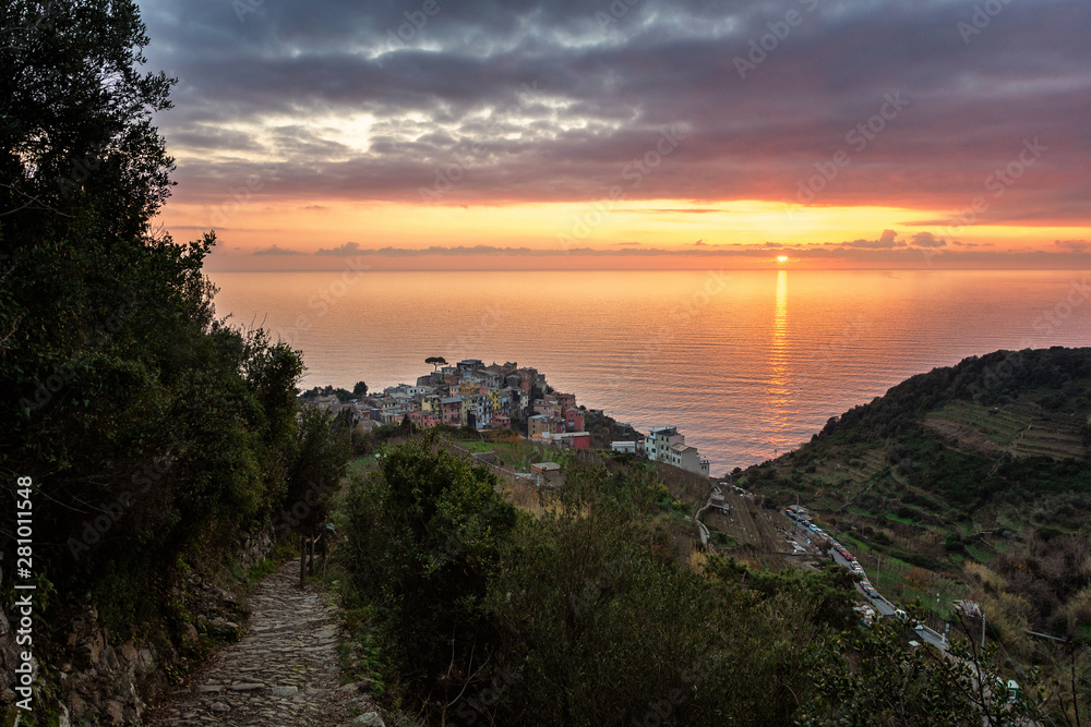 sunset on the beach. Ligurian coast. Cinque Terre National Park. Stone path to the sea. View of the stone sea coast of Italy. Sunset in Liguria. Winter Cinque Terre. 