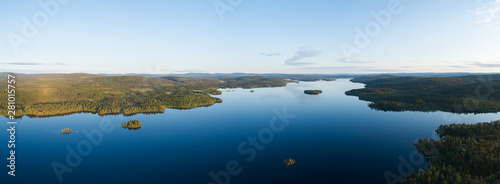 Aerial drone view of beautiful blue lake Inari and green forest. Beautiful summer panorama. Inarijarvi,Lapland