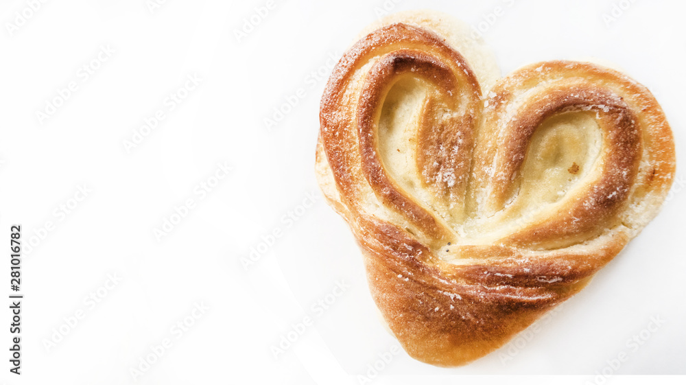 Bakery heart for Valentine's Day romantic sweet roll bun cookie isolated on white background with free empty copy space for text Bakery heart for Valentine's Day romantic sweet roll bun cookie isolated on white background with free empty copy space for text