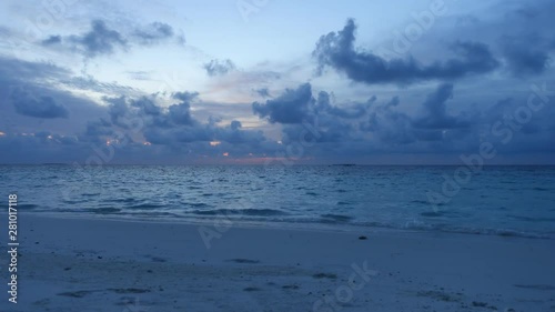 Sunset on the beach of private island Maldives with cloud moving, time lapse