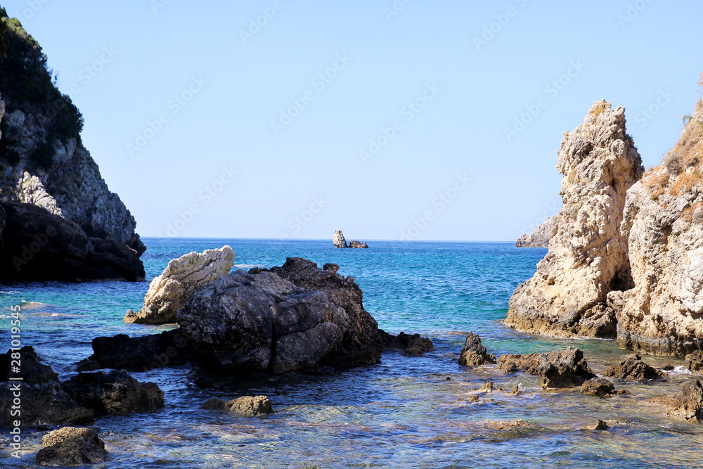 Big stone mountains and rocks coastline as islands in sea or ocean against clear sky landscape. Summer trip. Beautiful Greece. Most beautiful beach. Sea coast and beach beautiful natural horizon.