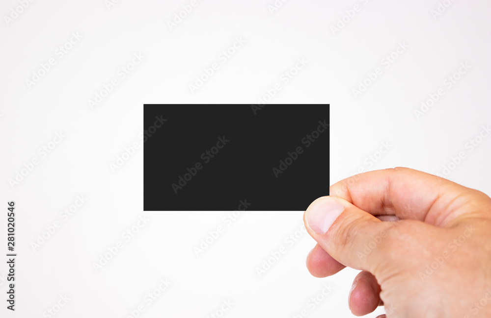 Man holding black business card mockup on isolated background Man holding black business card mockup on isolated background