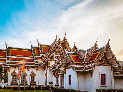 Thai temple with blue sky and flag