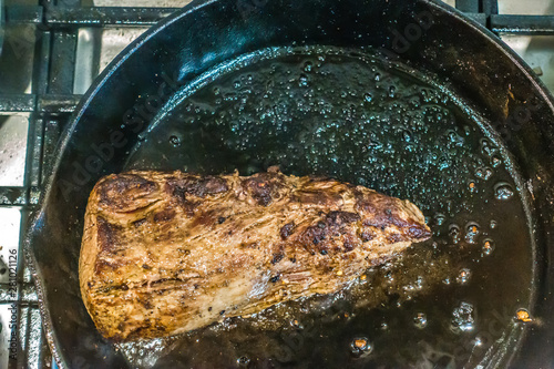 the making of tenderloin beef wellington for dinner photo