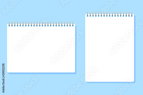 two notebooks of different sizes placed on a blue background