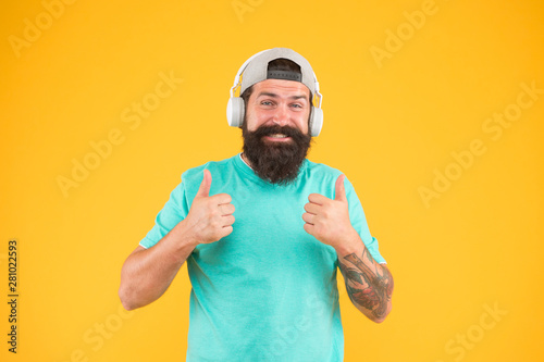 Lifestyle music fan. Man listening music wireless headphones. Hipster headphones gadget. Inspiring song. Music library. Bass low sound. Party every day. Rhythm of life. Bearded guy enjoy music