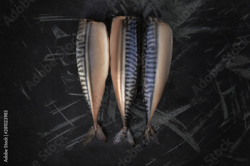 silver mackerel on a black background