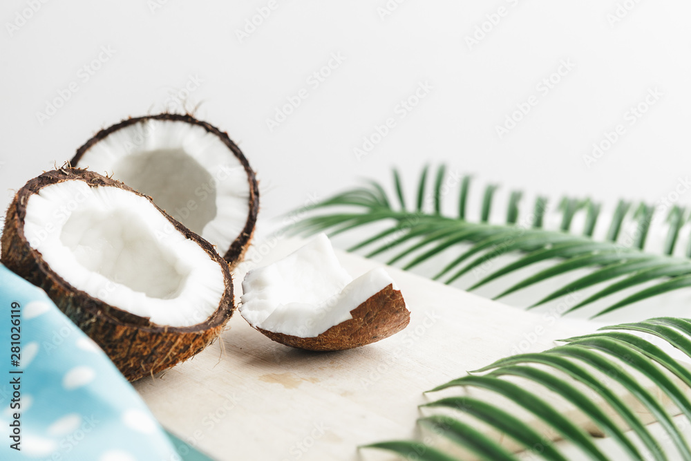Creative layout made of coconuts and tropical leaves. Food concept Creative layout made of coconuts and tropical leaves. Food concept