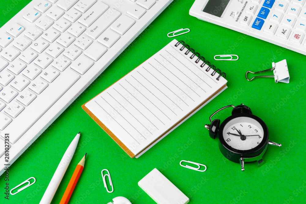 Green office desk with white stationery, copy space Green office desk with white stationery, copy space