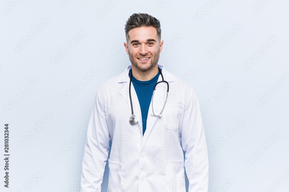 Young handsome doctor man happy, smiling and cheerful. Young handsome doctor man happy, smiling and cheerful.