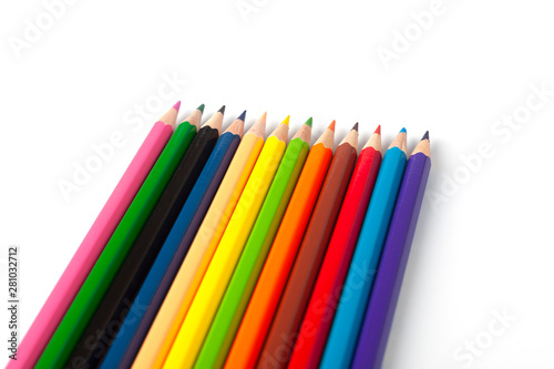 Color pencils lie on a white background