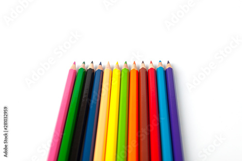 Color pencils lie on a white background