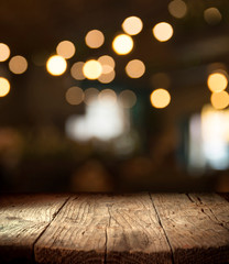blurred background of bar and dark brown desk space of retro wood