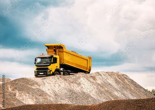 dump truck drops gravel photo