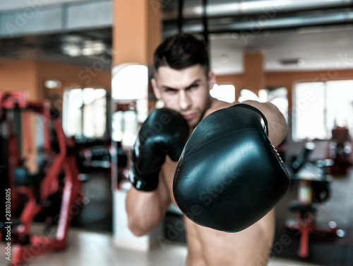 man with black boxing gloves © Volodymyr Shevchuk