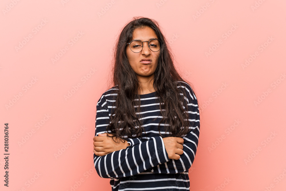 Young intellectual indian woman unhappy looking in camera with sarcastic expression. Young intellectual indian woman unhappy looking in camera with sarcastic expression.