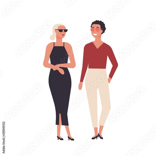 Pair of young smiling women dressed in elegant stylish clothes isolated on wh...
