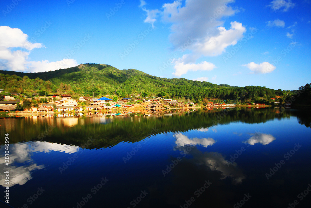 Beautiful landscape village on mountain and blue sky reflection in lake and river at Meahongson province, Thailand