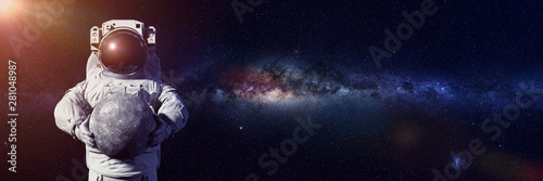 Fototapeta Naklejka Na Ścianę i Meble -  astronaut holding planet Mercury, world of the solar system