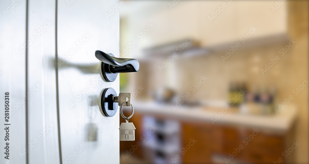 Open door with keys, key in keyhole Open door with keys, key in keyhole