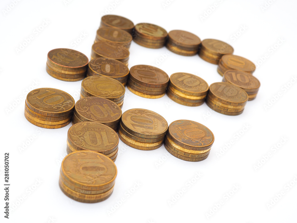 The sign of the Russian ruble, lined with piles of 10-ruble coins The sign of the Russian ruble, lined with piles of 10-ruble coins