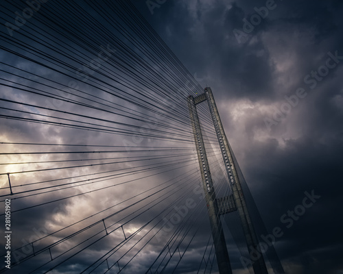 Pylon and cable-braced Pivdenny Mist (Southern Bridge) across the Dnipro river in Kyiv, Ukraine. Storm cloudy weather. photo