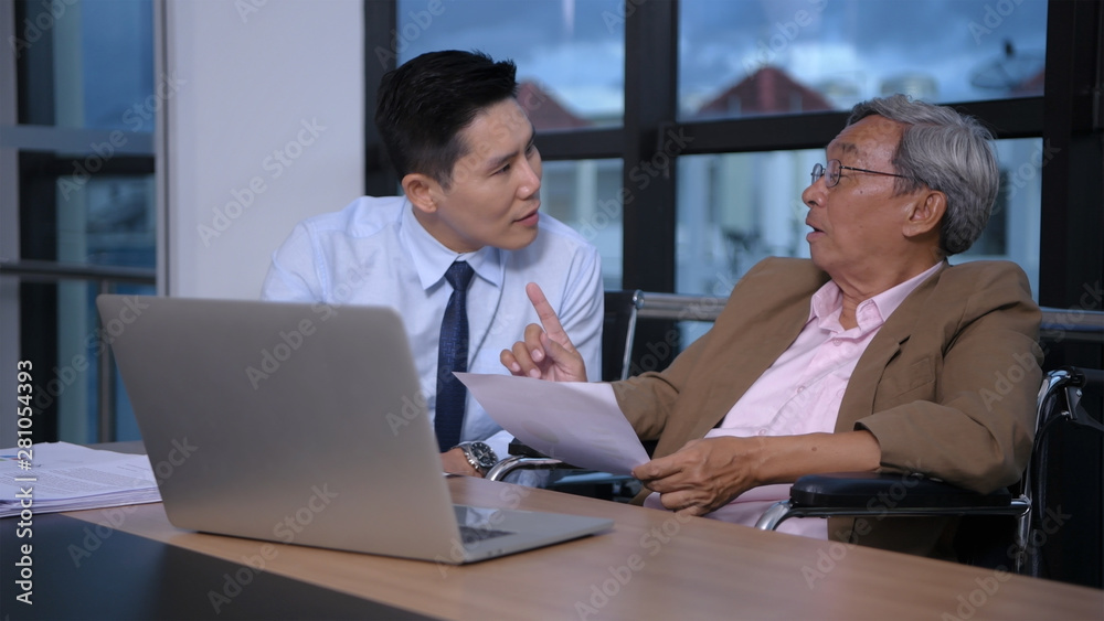 Business concept. People with disabilities are working with young men in the office. Business concept. People with disabilities are working with young men in the office.