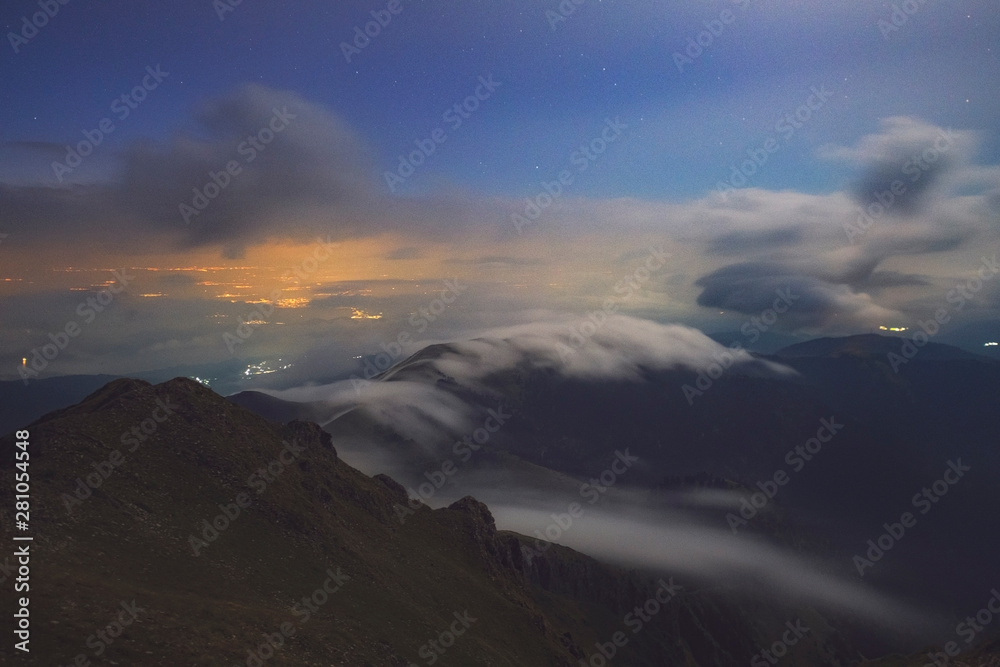 Clouds and mist on a moonlighted night on Agrafa Mountains Clouds and mist on a moonlighted night on Agrafa Mountains