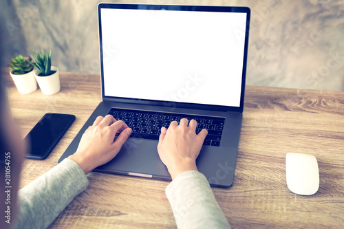 asian woman using laptop computer do online activity on wood table at home office.