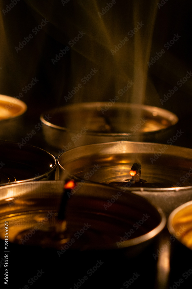 Candles close-up in the black background. Candles close-up in the black background.