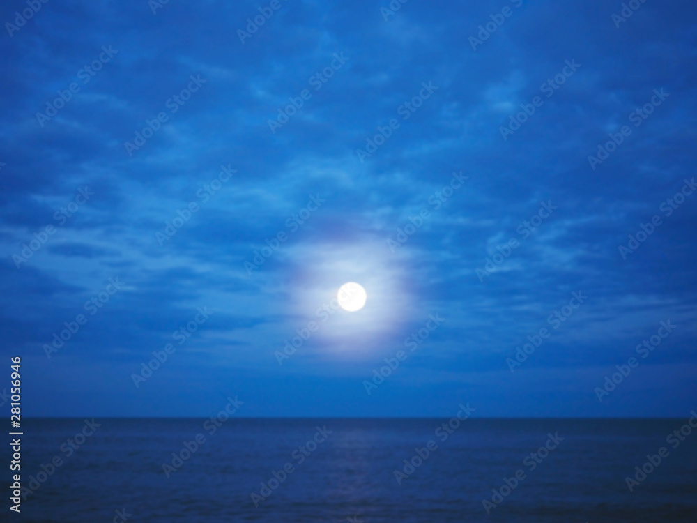 Abstract blur background of night sky and dark blue sea.