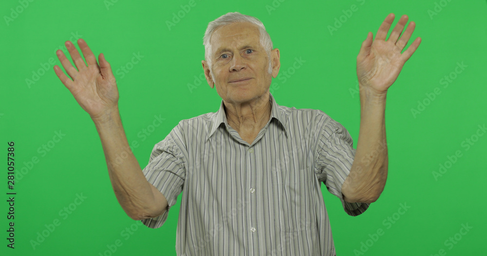 Senior man waving hands to camera. Handsome old man on chroma key background