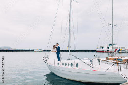 Wedding couple on the yacht, lovers posing on the yacht © Shopping King Louie