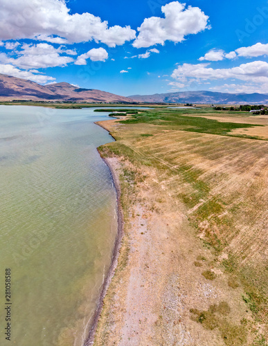 Aerial view of Lake Van the largest lake in Turkey  lies in the far east of that country in the provinces of Van and Bitlis. Fields and cliffs overlooking the crystal clear waters. Road