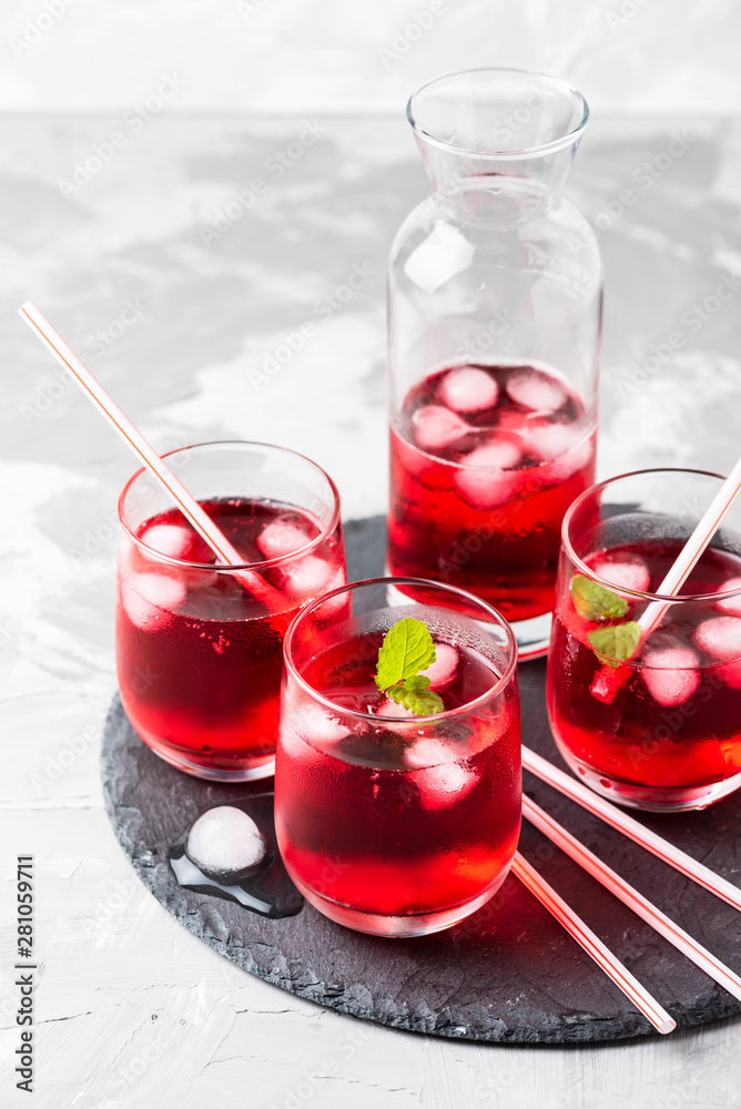 Red alcoholic coctail with ice and mint Red alcoholic coctail with ice and mint