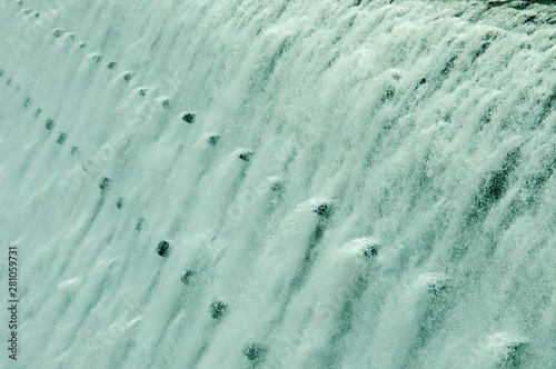 Gushing water going over the top of the dam at Elan valley, Wales. photo