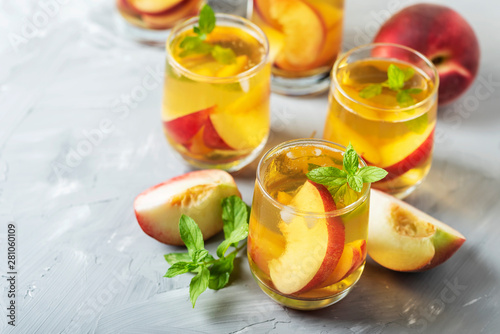 Summer cold tea with peaches and mint