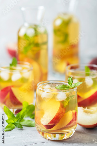 Summer cold tea with peaches and mint