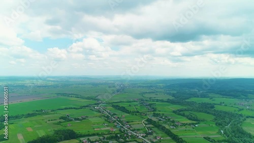 Aerial view of picturesque lanscape and cloudy sky over it. 4K.