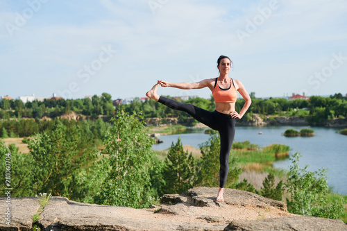 Young attractive woman Standing balancing pose