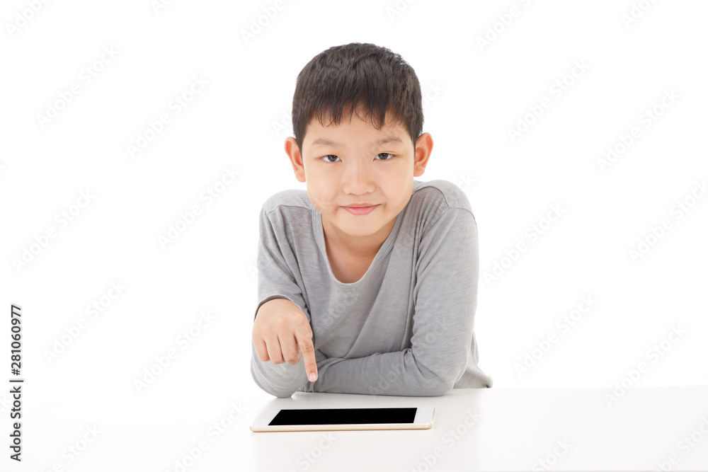 Asian boy using tablet computer isolated on white background. Look at Camera Pose. Asian boy using tablet computer isolated on white background. Look at Camera Pose.