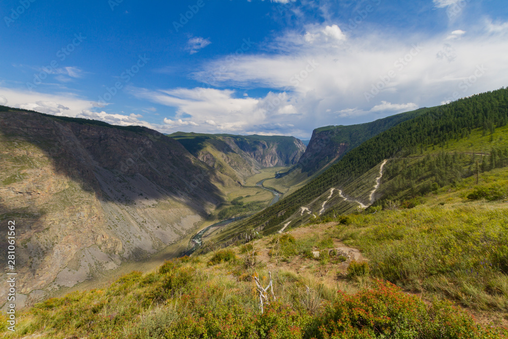 Valley of the river, top view. Altay mountains. Summer sunny day. Mountain car pass