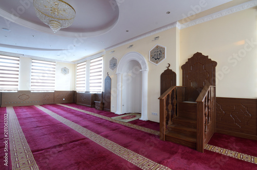 View of hall for praying (iwan) of a mosque with minbar (pulpit) photo