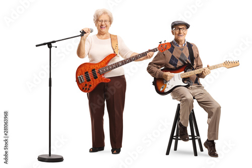 Elderly man and woman with guitars and a microphone © Ljupco Smokovski